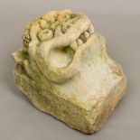 A carved limestone gargoyle Typically modelled. 31 cm high.