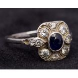 An Art Deco white gold or platinum diamond and sapphire ring The central set sapphire surrounded by