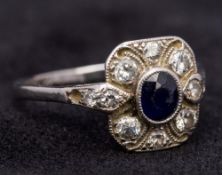 An Art Deco white gold or platinum diamond and sapphire ring The central set sapphire surrounded by