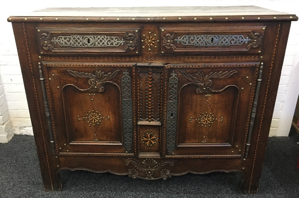 An 18th century French polished steel and brass mounted inlaid chestnut buffet The moulded