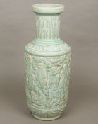 A large Chinese pottery vase Decorated in the round with deities and attendants amongst clouds,