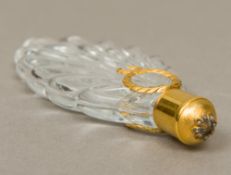 A diamond set gold mounted cut clear crystal glass scent bottle With diamond capped domed removable
