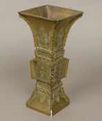 An archaistic style Chinese bronze vase Of flared square sectional form,