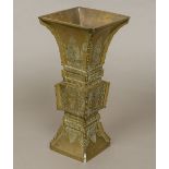 An archaistic style Chinese bronze vase Of flared square sectional form,