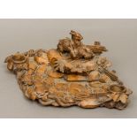 A Black Forest carved wooden desk stand Carved with two hares amongst naturalistic setting,