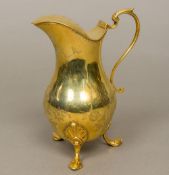 A 19th century silver gilt lidded jug, hallmarks indistinct Of waisted baluster form,