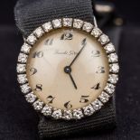 An 18 ct gold cased diamond set lady's cocktail watch The diamond set bezel enclosing the champagne