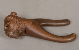 A treen nutcracker Worked as a lion maned monkey. 20 cm long.