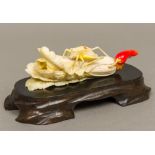 A fine quality early 20th century Chinese painted carved ivory model of a cricket on a