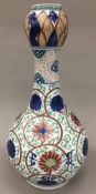 A Chinese porcelain onion neck bottle vase Decorated with lotus strapwork,