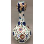 A Chinese porcelain onion neck bottle vase Decorated with lotus strapwork,