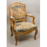 A late 19th century French tapestry covered open armchair The carved top rail with gilt and red