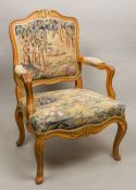 A late 19th century French tapestry covered open armchair The carved top rail with gilt and red