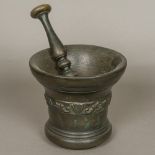 A large 17th century bronze mortar with double ended pestle, probably Whitechapel,