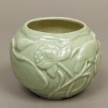A Chinese celadon ground vase Of squat globular form, decorated with a bird amongst lilies,