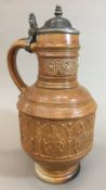 An early 17th century Raeren stoneware seven electors panel jug,