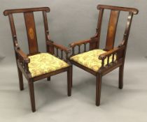 A pair of late Victorian/Edwardian inlaid mahogany and beech open armchairs Each crossbanded curved