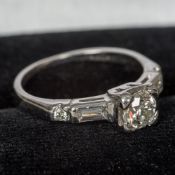 A 22 ct white gold diamond ring The central stone spreading to approximately 0.
