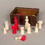 A Victorian English carved ivory chess set Housed in a wooden box. The kings each 6.7 cm high.