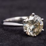 An 18 ct white gold 3 carat diamond solitaire ring The claw set stone above the plain shank. 1.