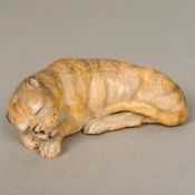 A 19th century Japanese pottery tiger Naturalistically modelled recumbent. 13 cm long.