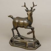 An 18th century Chinese bronze stag Naturalistically cast on integral pierced plinth base. 31.