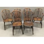A harlequin set of six 19th century elm seated wheel back chairs,