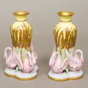 A pair of Royal Worcester Aesthetic porcelain vases Each central vase gilt decorated with bulrushes