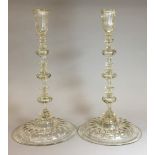 A pair of 17th century style candlesticks Each with knopped stem and moulded foot. 34 cm high.