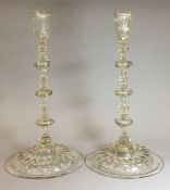 A pair of 17th century style candlesticks Each with knopped stem and moulded foot. 34 cm high.
