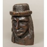 A 19th century Continental carved wood mask The long haired figure wearing a hat, flat backed.