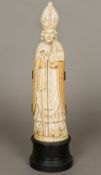 A large early 19th century Dieppe carved ivory triptych Formed as a bishop enclosing a scene of