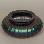 A "Loetz" glass vase Of squat ribbed form, with typical iridescent lustre (unsigned).