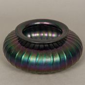 A "Loetz" glass vase Of squat ribbed form, with typical iridescent lustre (unsigned).