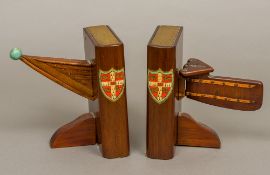 A pair of early 20th century Cambridge University mahogany rowing bookends Mounted with the prow