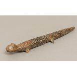 A possibly Pre-Colombian terracotta flute Worked as a lizard; together with a pottery fragment.