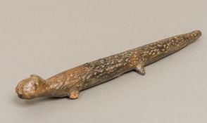 A possibly Pre-Colombian terracotta flute Worked as a lizard; together with a pottery fragment.