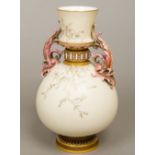 A 19th century Royal Worcester porcelain twin handled vase Typically worked on an ivory ground,