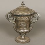 A George IV silver lidded twin handled trophy cup, hallmarked London 1824,