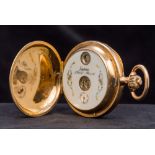 An unmarked 14 ct gold full hunter jump hour pocket watch The decorated white enamelled dial