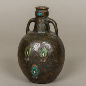 An antique enamel decorated patinated bronze bottle vase Of squat bulbous twin handled form,