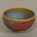 A Chinese Jun ware bowl With mottled blue red glaze. 5 cm high.