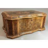 A 19th century Italian olive wood, walnut and specimen wood inlaid box Of serpentine form,