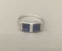 An Art Deco diamond and sapphire set ring The square cut sapphires interspersed with baguette cut