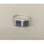 An Art Deco diamond and sapphire set ring The square cut sapphires interspersed with baguette cut