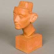 A painted plaster museum copy of an Egyptian bust Typically modelled on a plinth base. 30 cm high.