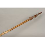 A Fijian tribal spear Of multi-spiked form with woven hand grip. 178 cm long.