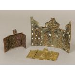 A 19th century Continental enamel decorated brass religious triptych Of typical folding form;