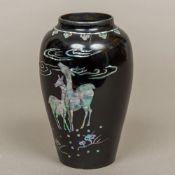 A late 19th/early 20th century Chinese mother-of-pearl inlaid enamelled vase Of tapering baluster