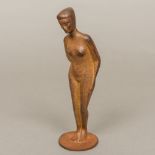 A 20th century Art Deco Hagenhauer inspired cast metal figure Modelled as a standing female nude,